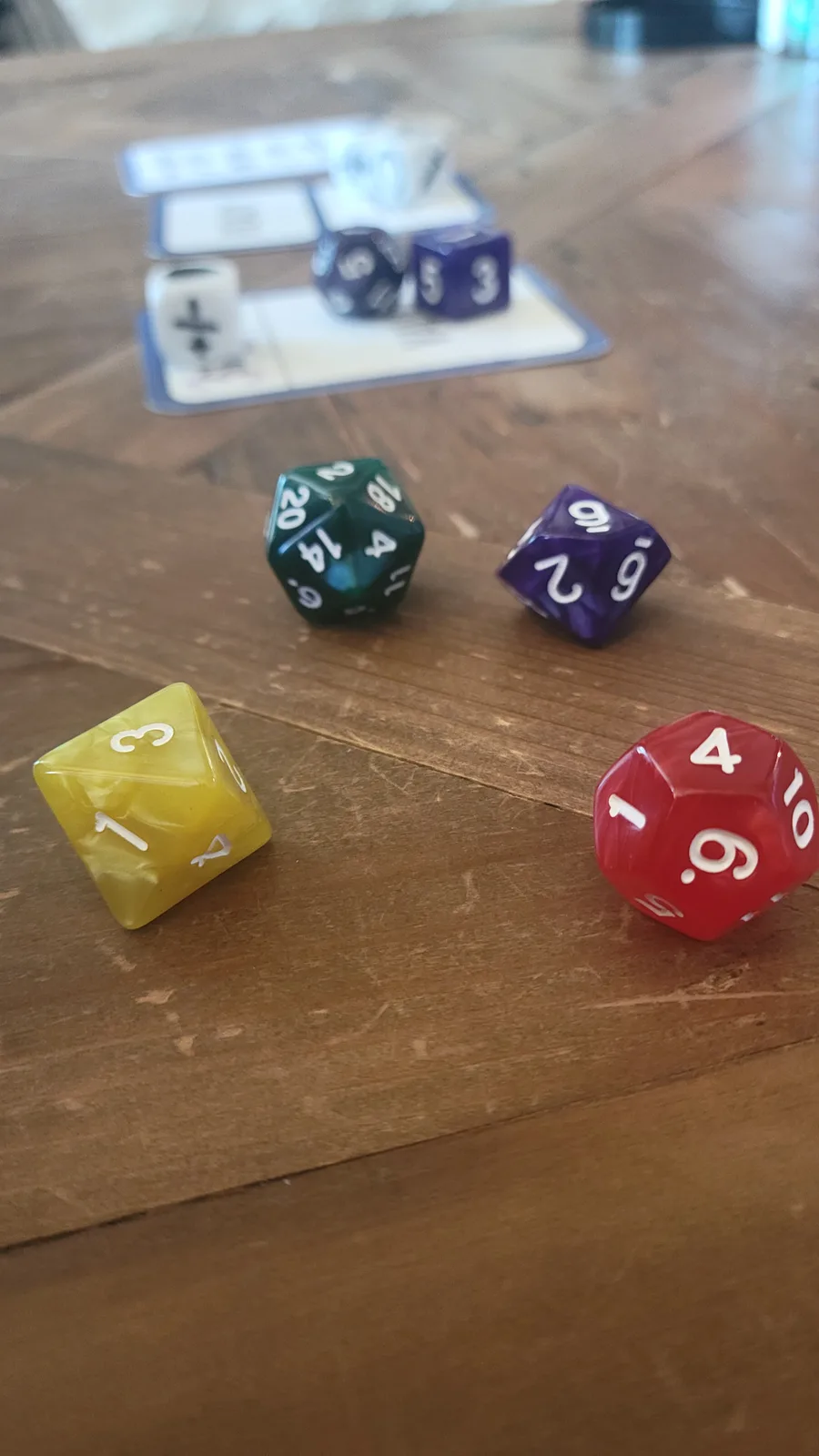 Colorful MOJA game pieces in play on a wooden table